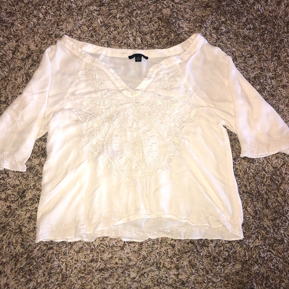 American Eagle cream blouse with beading detail